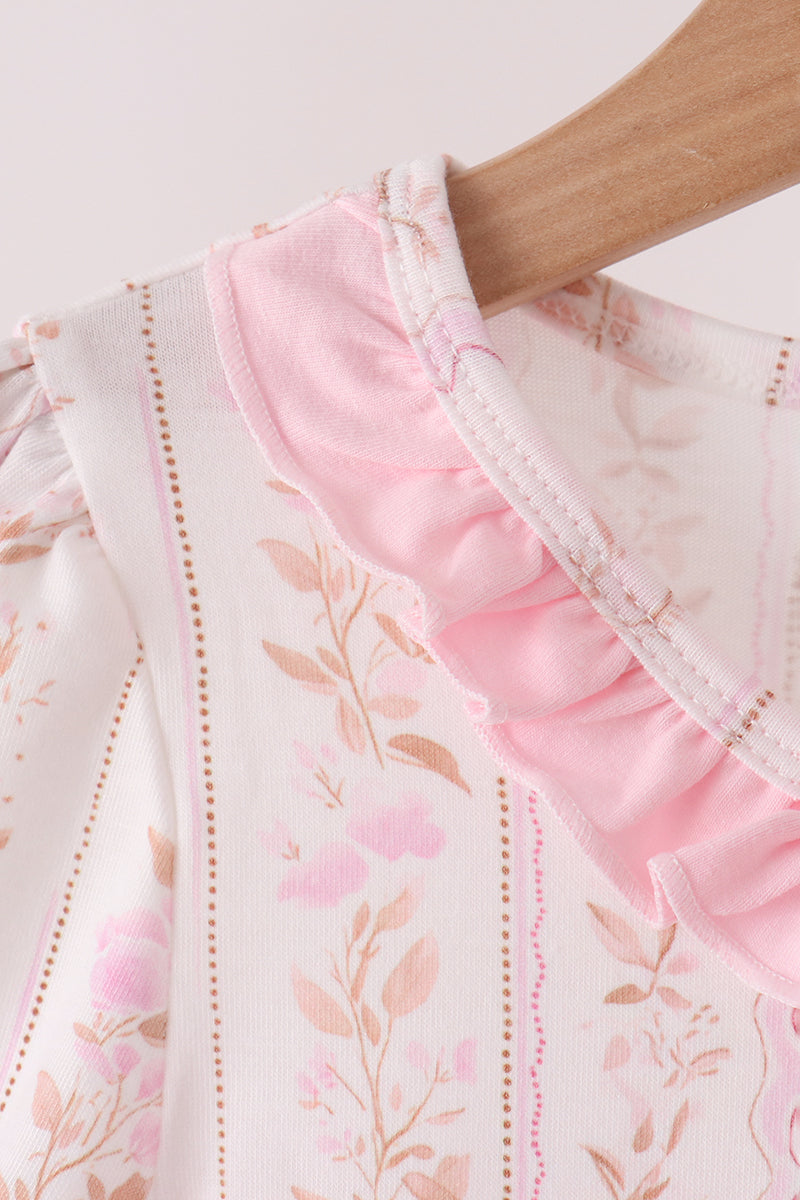 Pink-trimmed ruffle collar and floral embroidered yoke on a girls dress