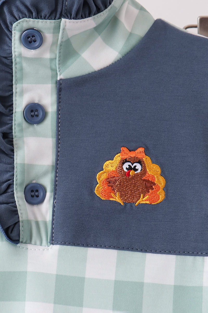 Navy vest-style top with gingham placket and embroidered turkey chest applique