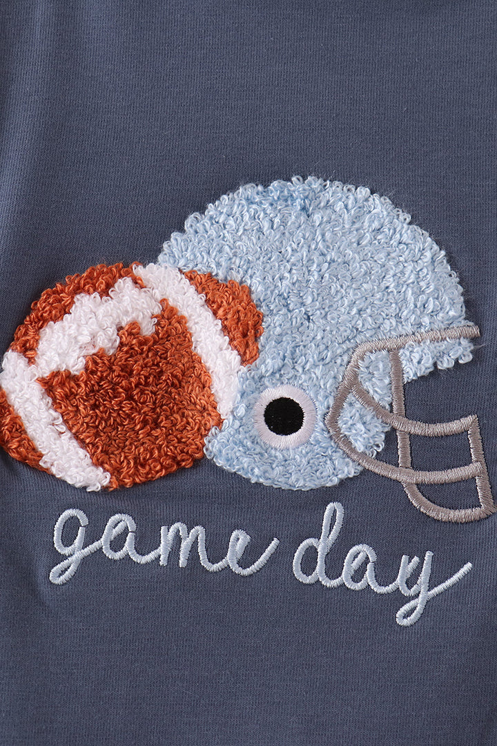 Navy jon jon with embroidered football helmet, football, and game day script
