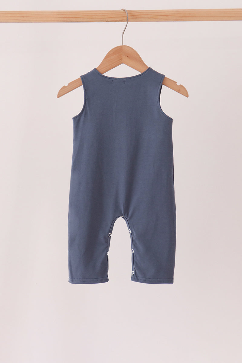 Navy sleeveless romper with button straps and pant-style legs