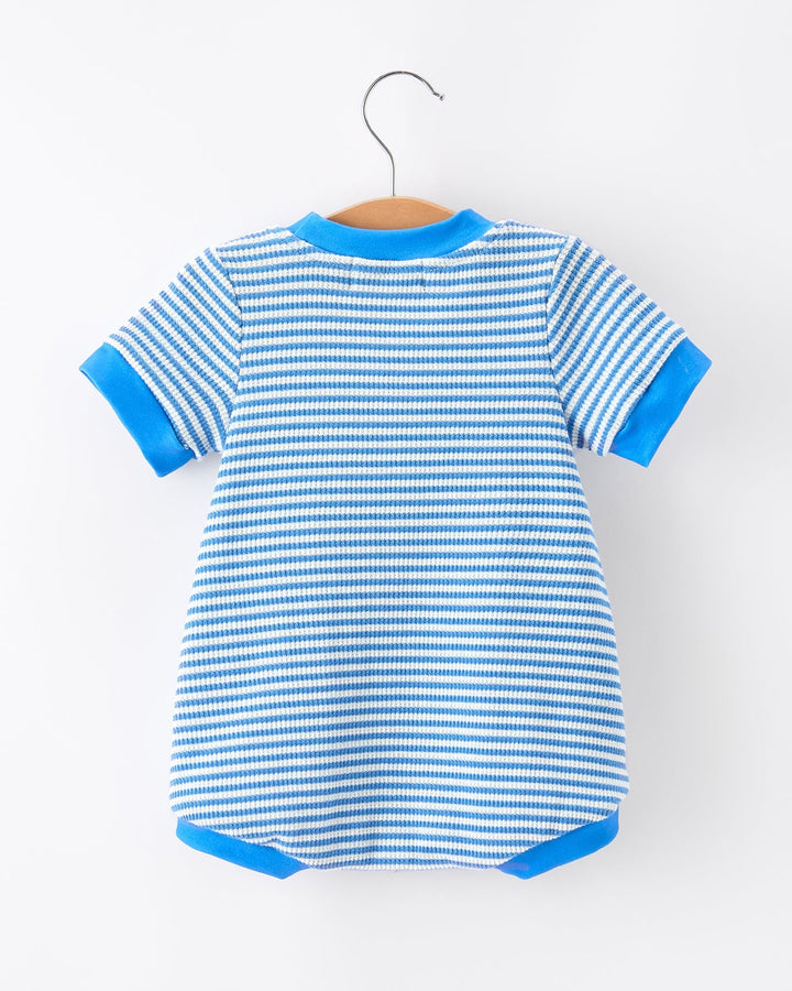 Blue and white striped baby romper on a hanger against a white background