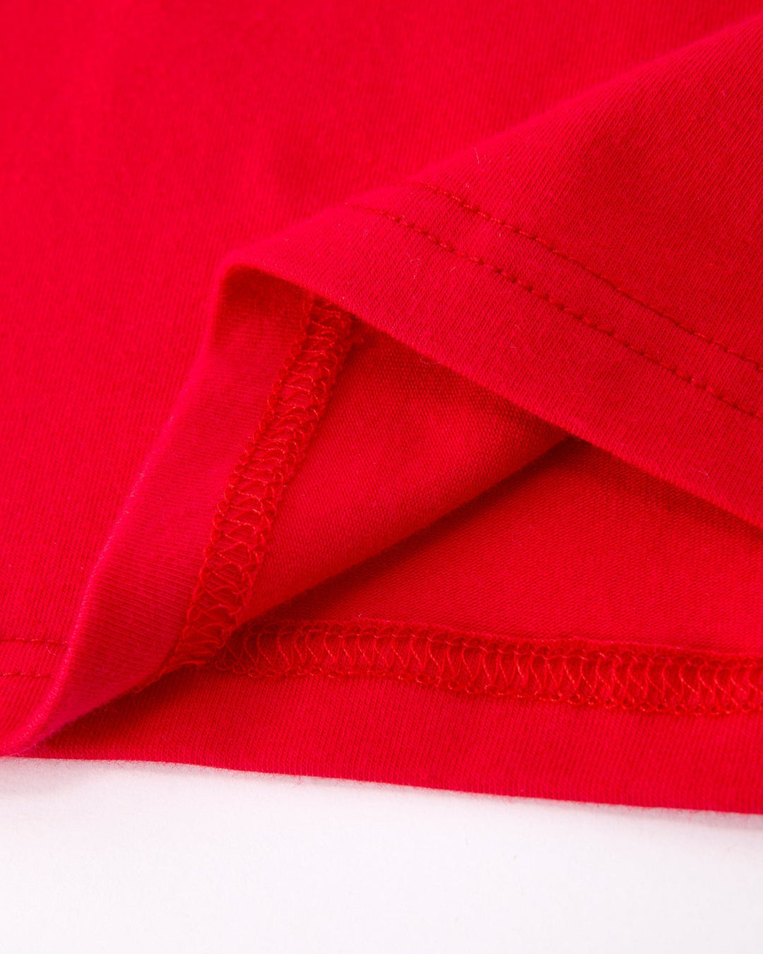 Close-up of red fabric with a white background