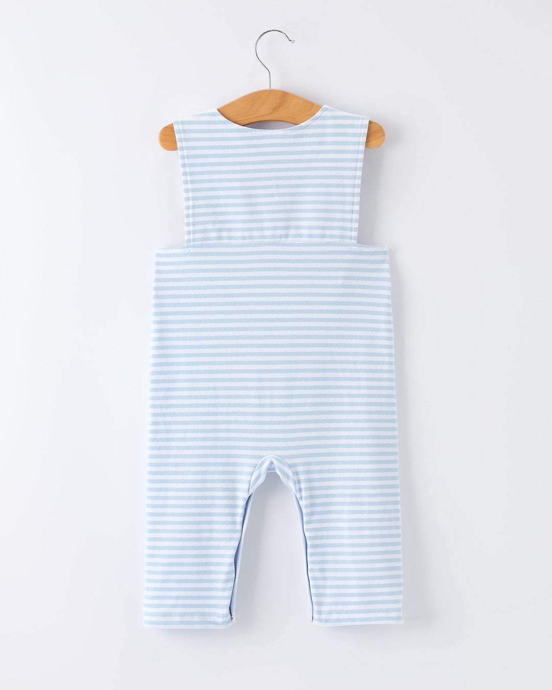 Blue and white striped baby romper on a hanger against a white background