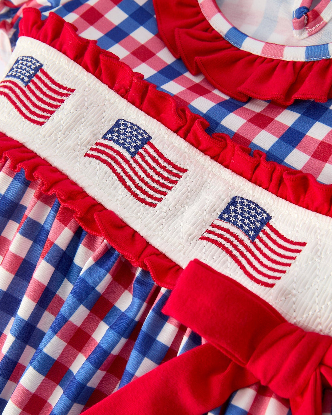 Red, white, and blue checkered fabric with American flag patterns