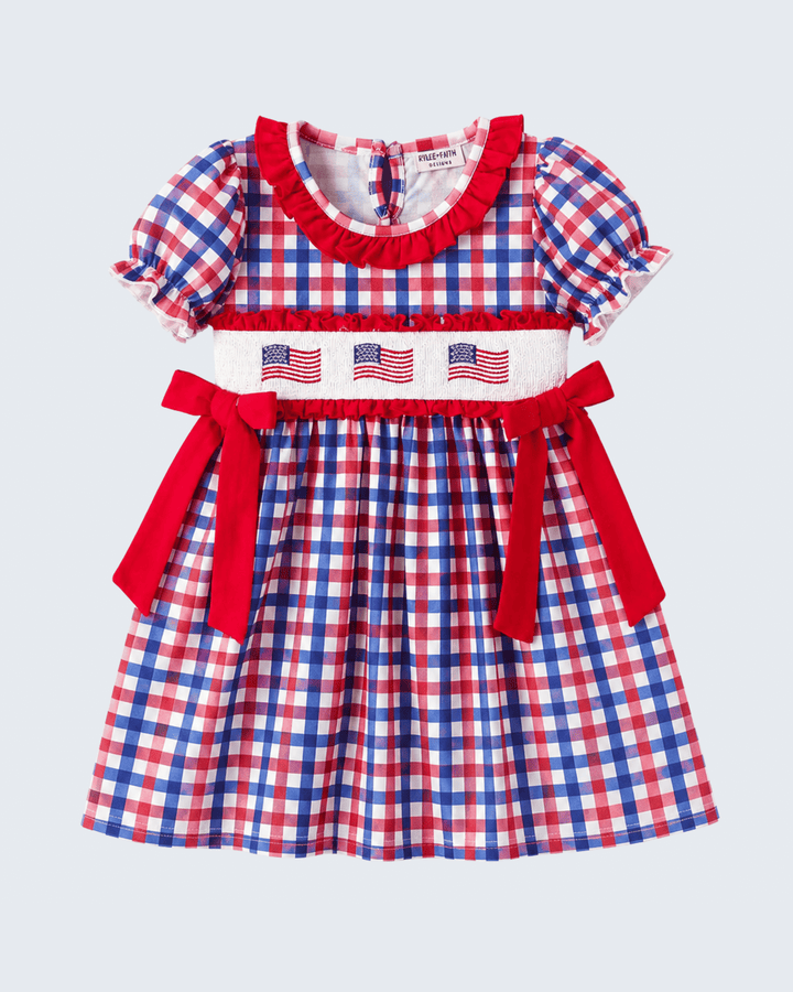 Red, white, and blue checkered dress with American flag design on a light gray background