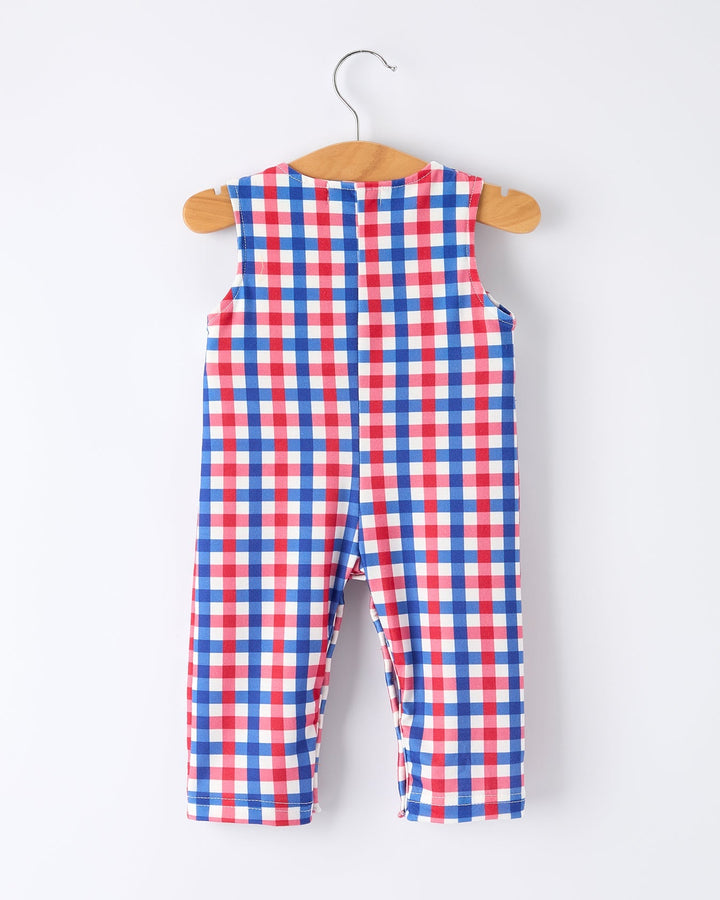 Red, white, and blue checkered romper on a hanger against a white background