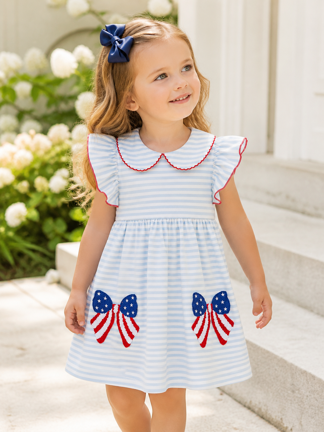 Blue &amp; white stripe dress. Girl by stairs.
