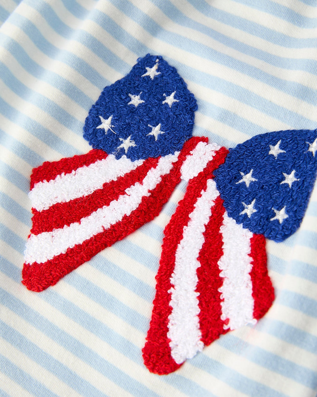 American flag-themed headbands on a striped background