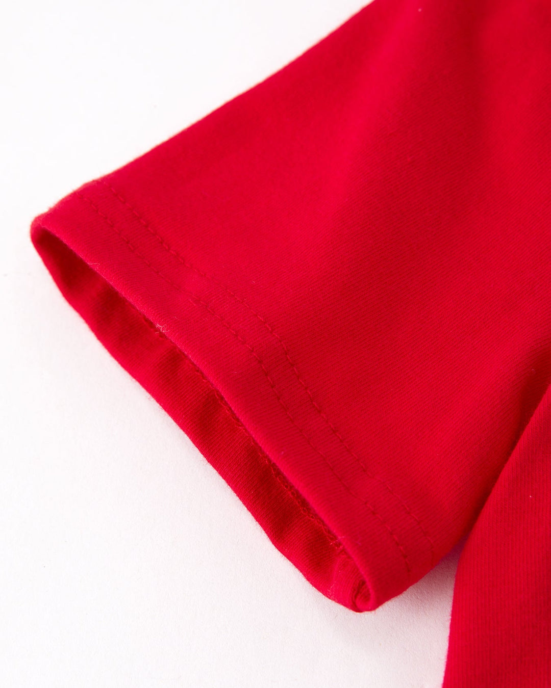 Close-up of red fabric on a white background