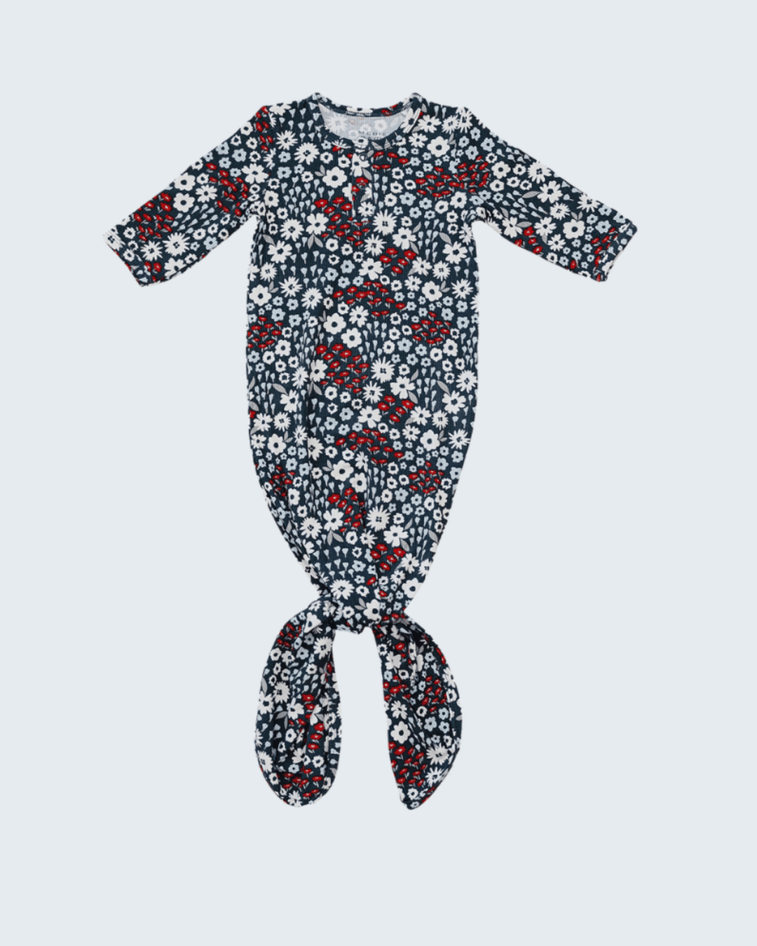 Floral patterned baby onesie on a light gray background