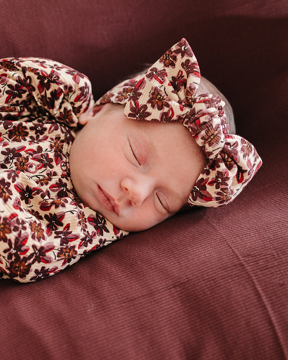 Baby head wrap with twisted knot, cream and dark red floral print on ribbed fabric