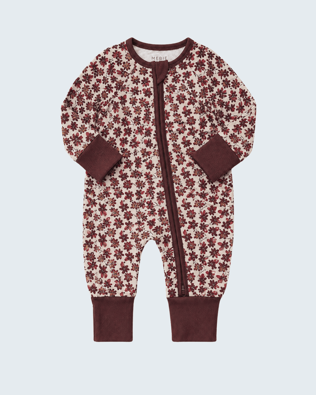 A baby one-piece footless sleeper with a brown and cream floral pattern, featuring a front zipper, long sleeves, and ribbed cuffs and collar, shown on a light gray background.