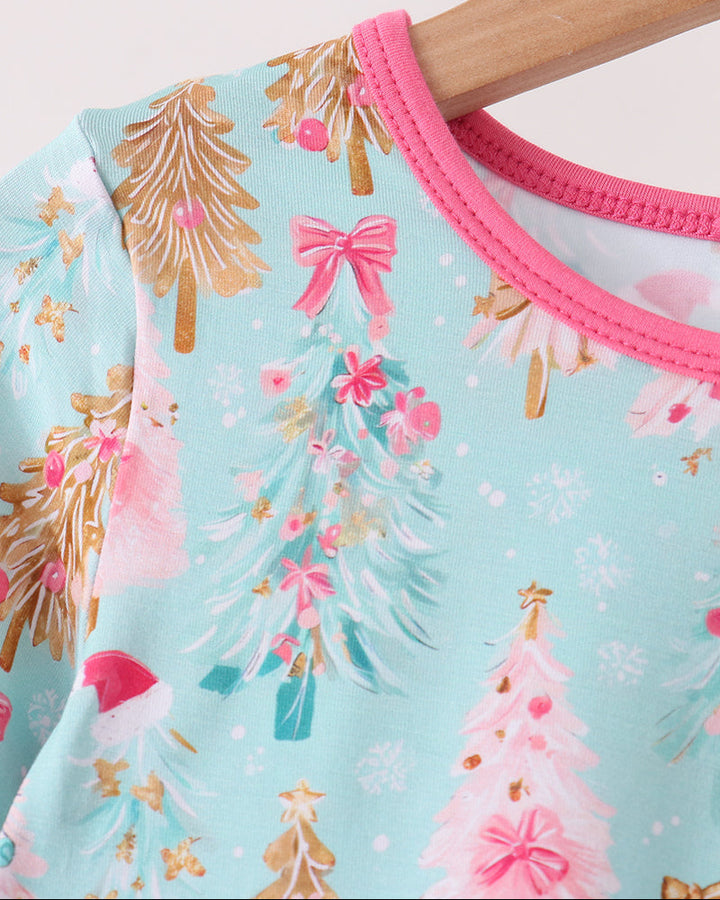 Light blue bamboo pajama top close-up with pink crew neck trim and tree-print