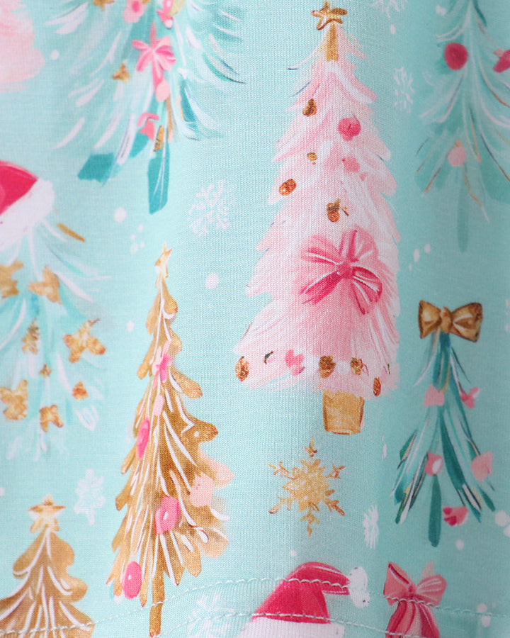 Bamboo pajama fabric detail with Christmas trees, pink bows, and gathered hem