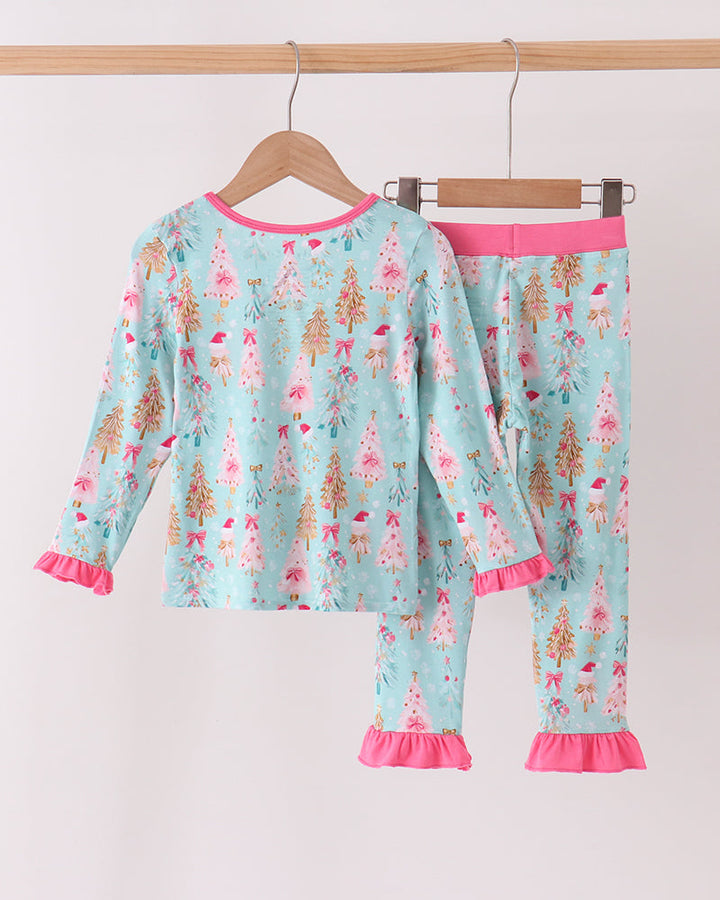 Bamboo pajama set on hangers in light blue with Christmas tree print and pink cuffs