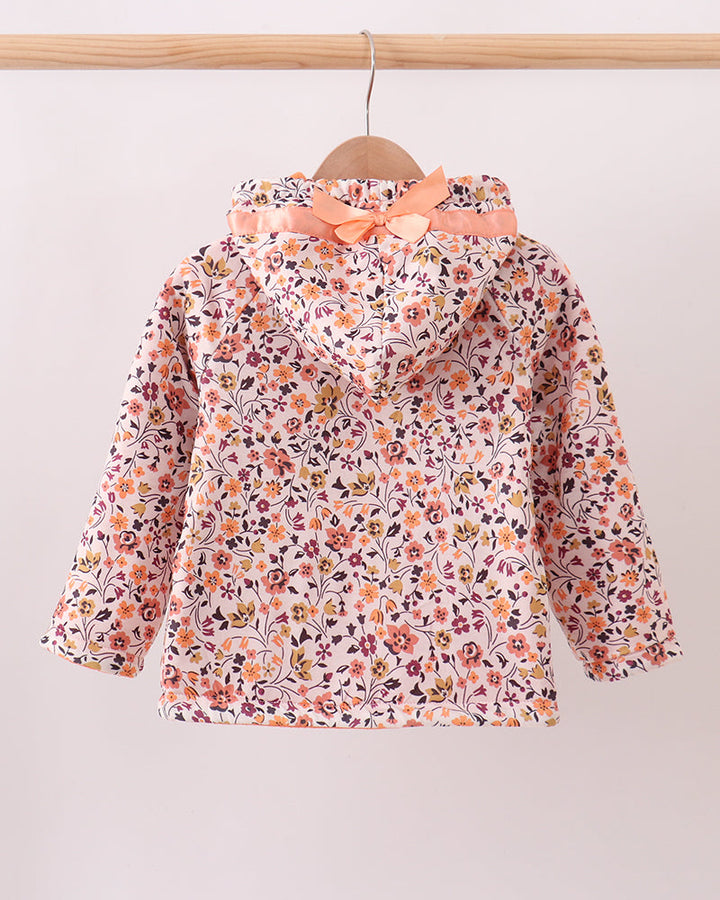 Floral hooded fleece coat with orange inner hood, hanging on wooden hanger
