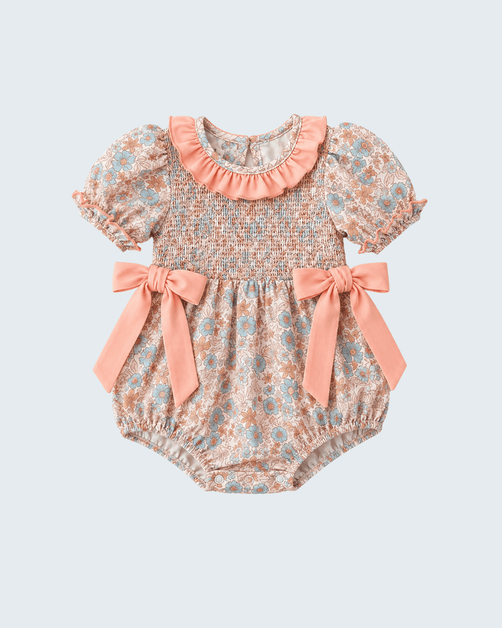 Multicolor floral smocked romper with ruffled collar and tied bow straps