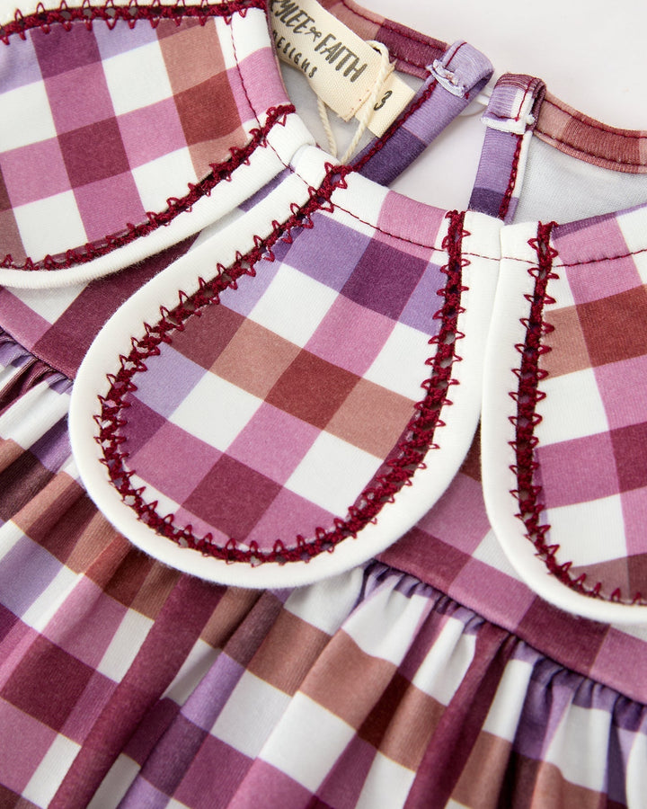 Girls plaid dress neckline close-up with scalloped petal collar and keyhole opening