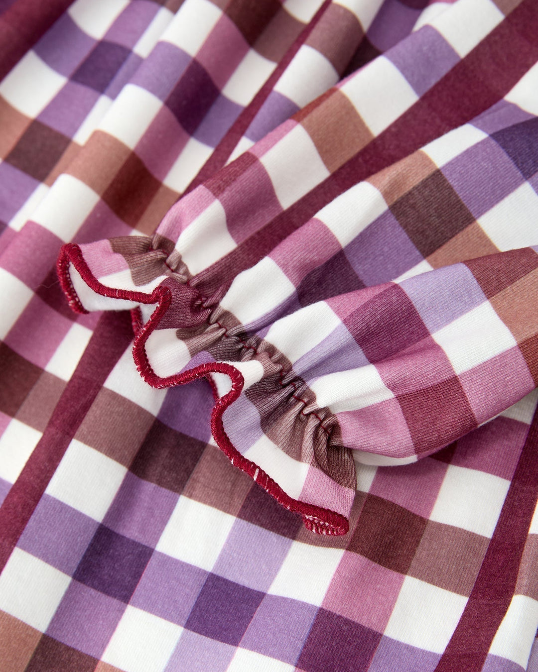 Girls plaid dress sleeve with gathered cuff and decorative red trim