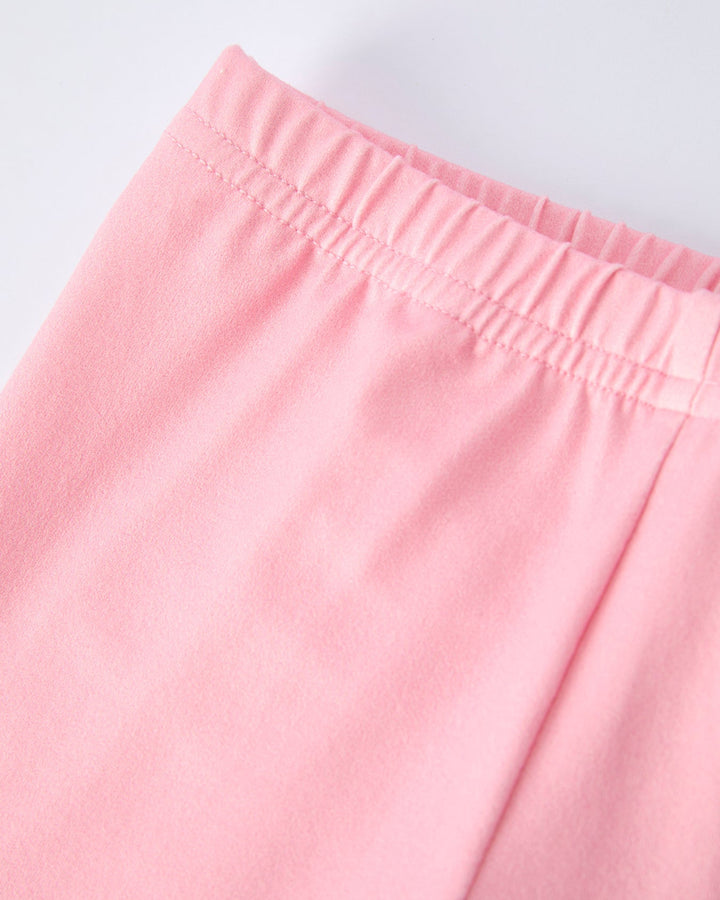 Close-up of pink pants on a light gray background