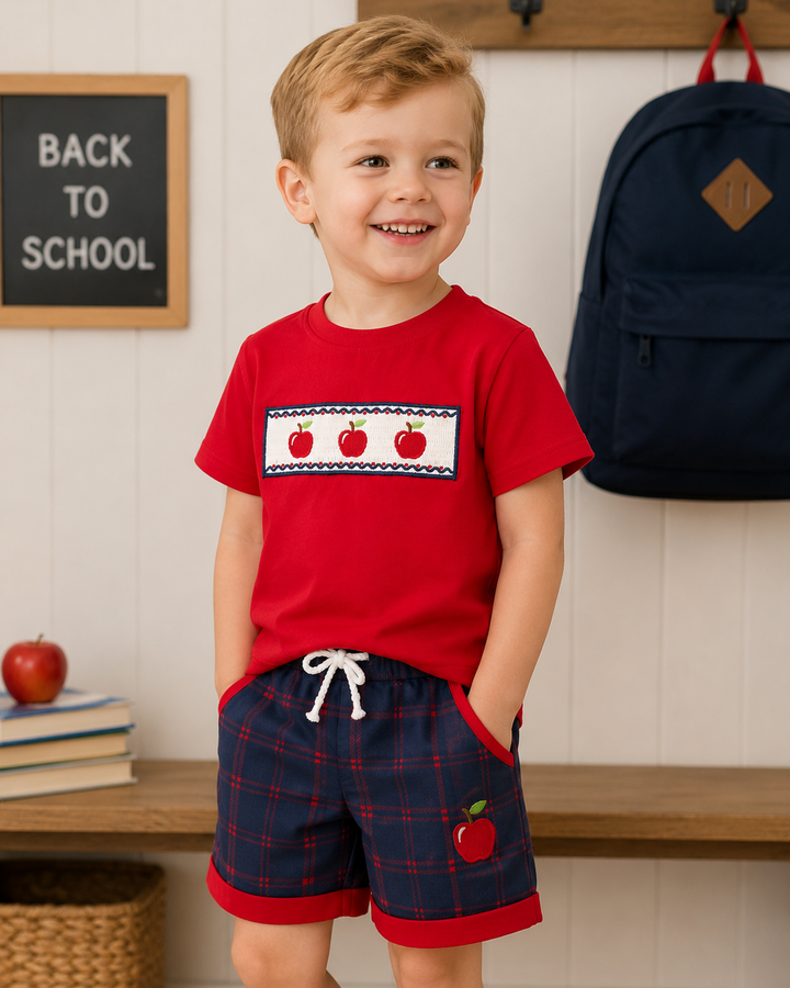 Boy in back to school outfit with apple print