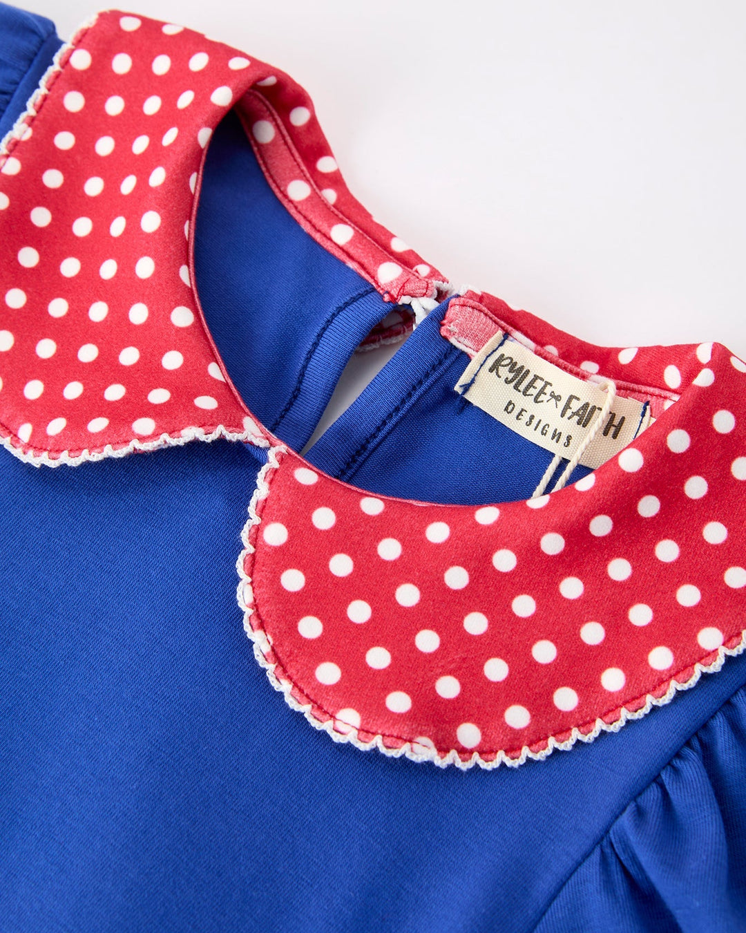 Blue dress with red polka dot collar and &