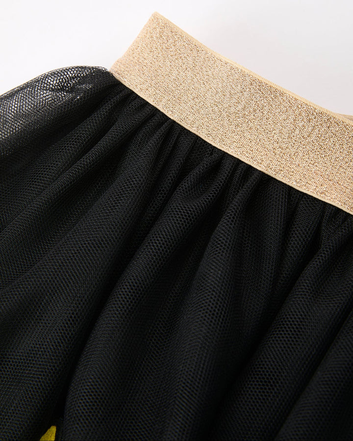 Black skirt with a beige waistband on a white background