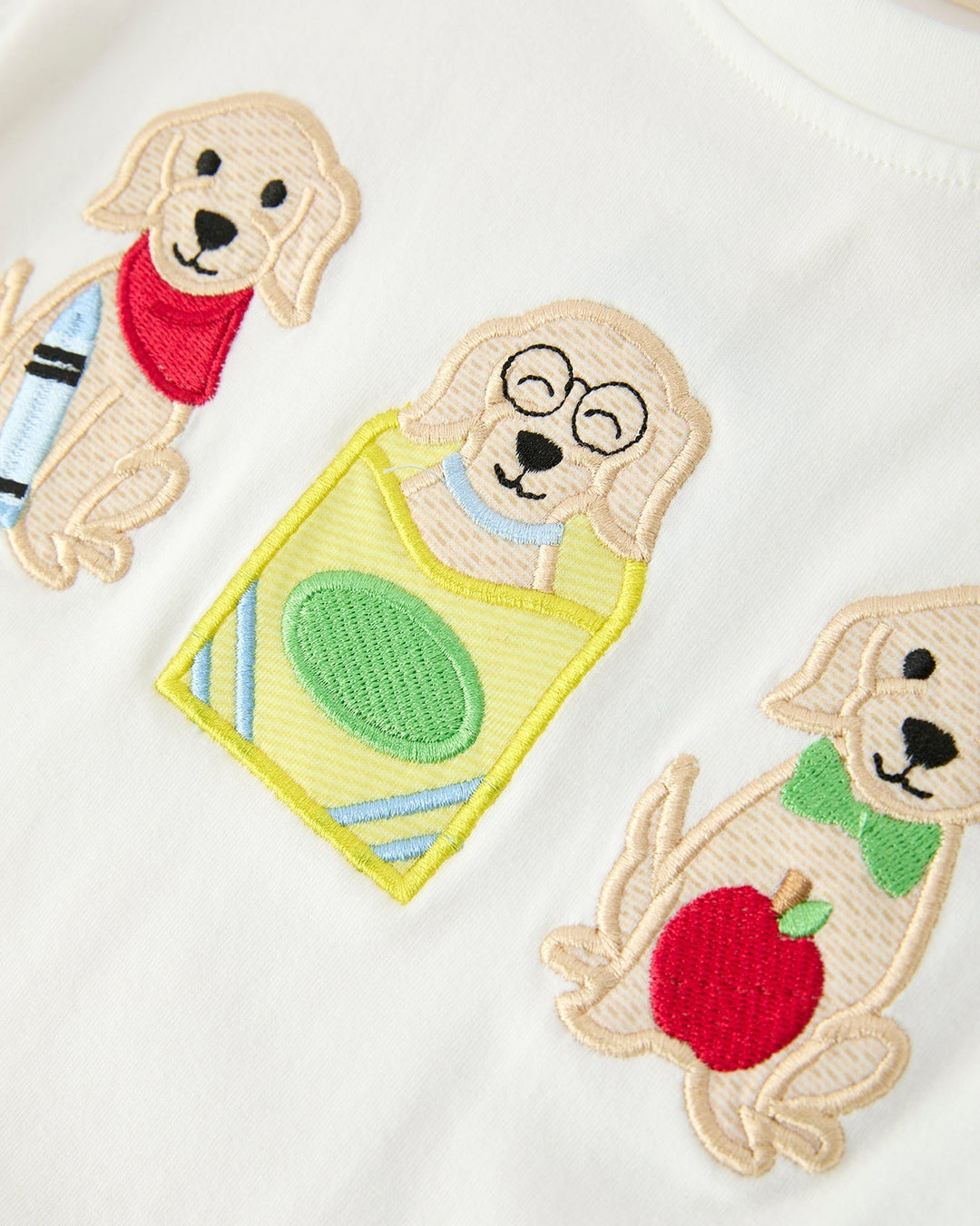Embroidered dogs with accessories on a white background