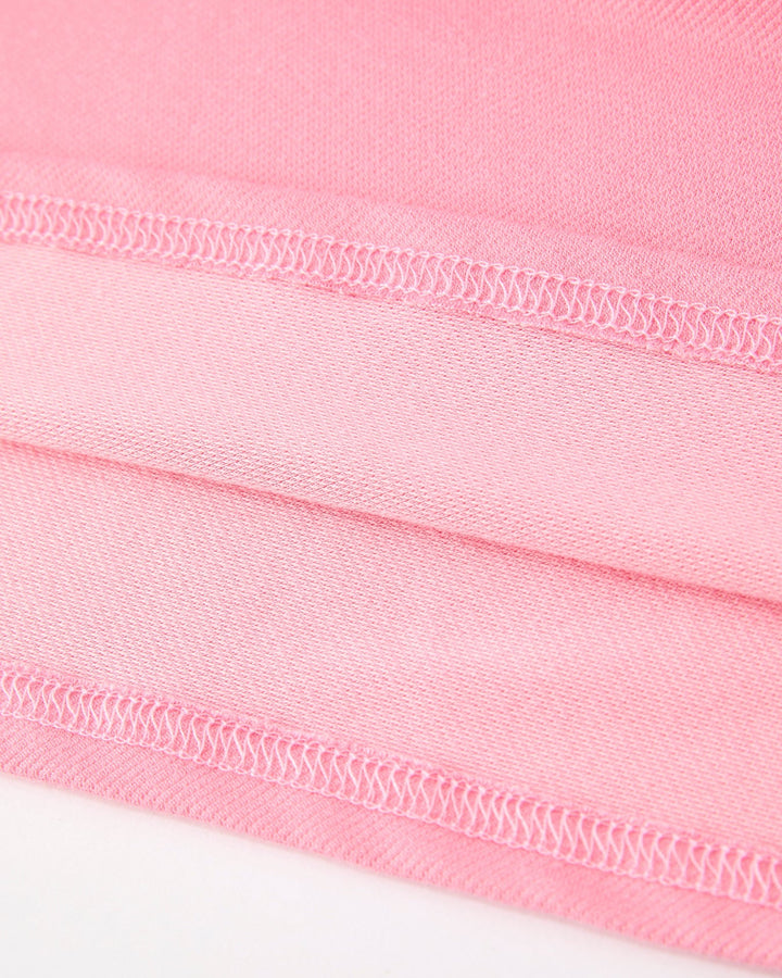 Close-up of pink fabric with a white background
