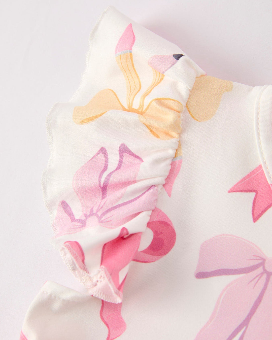 Baby outfit with floral pattern on a white background