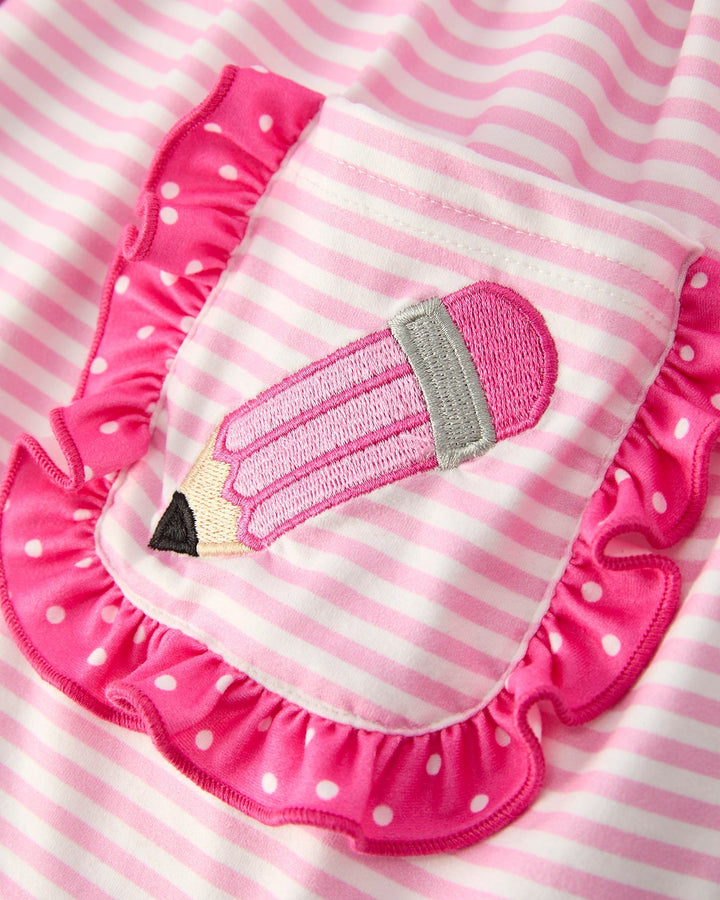 Pink and white striped bib with pencil design on a pink and white striped background