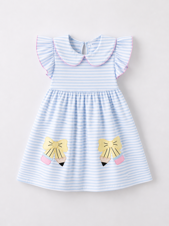 Blue and white striped dress with lion face designs on a light gray background