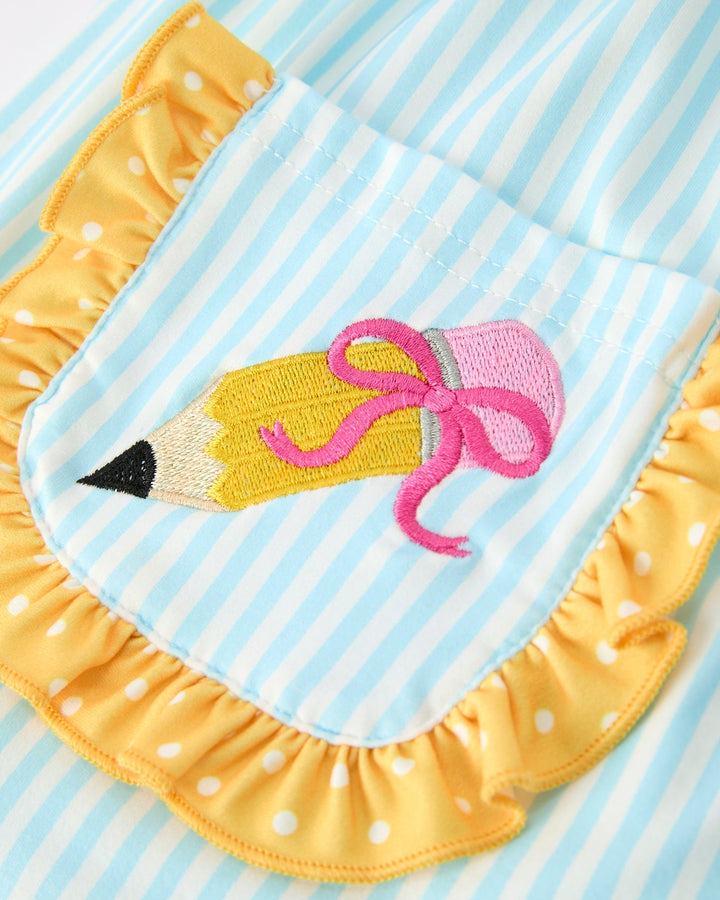 Yellow outfit with a pencil and bow design on a blue and white striped background