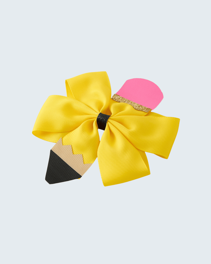 Hair bow with pencil design on a light gray background