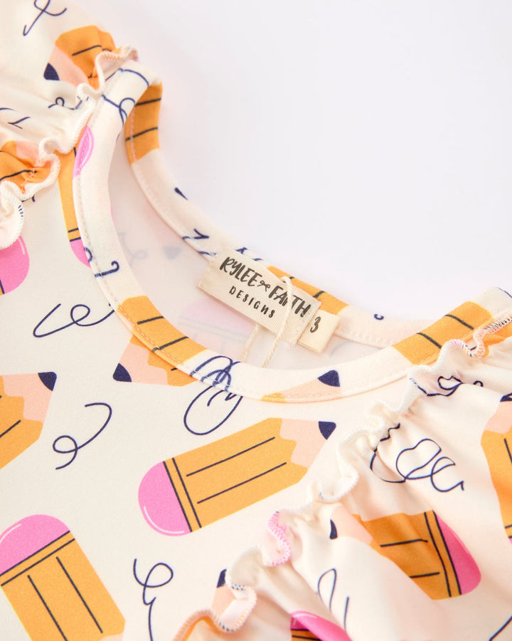 Dress with pencil pattern on a light background