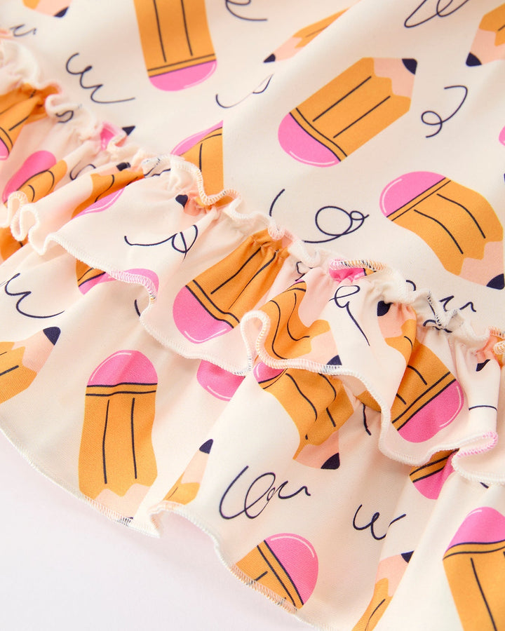 Dress with pencil designs on a white background
