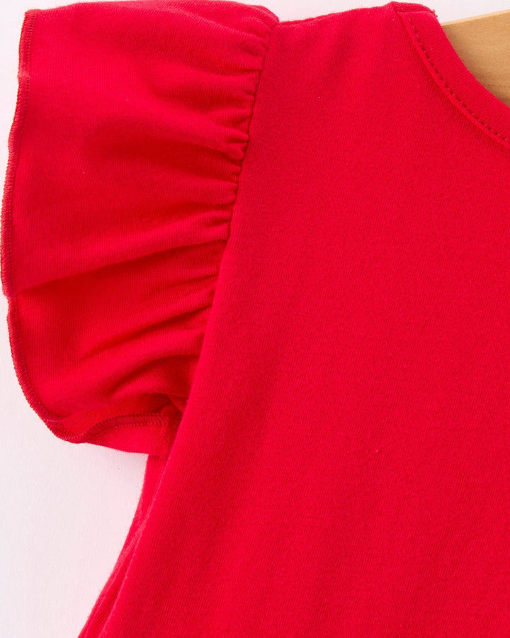 Close-up of a red sleeveless top on a white background