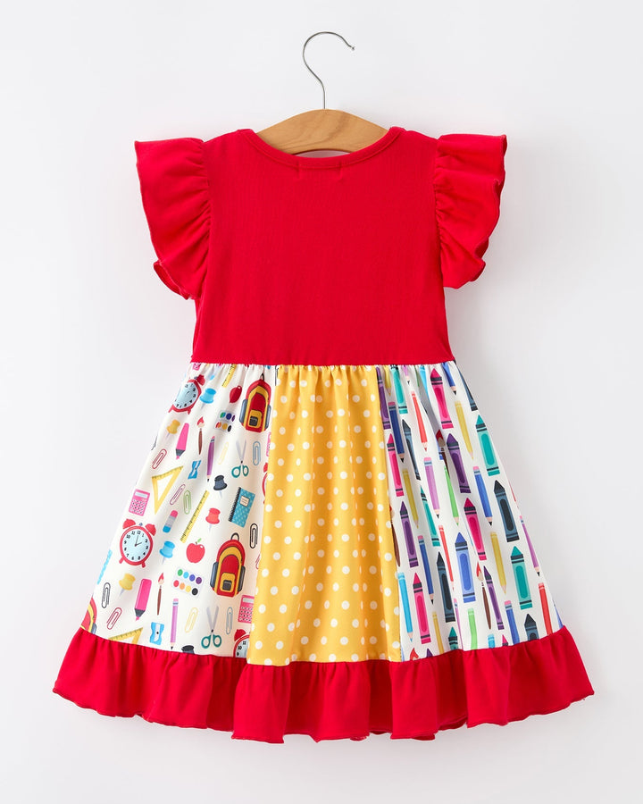 Colorful dress with a red top and patterned skirt on a white background