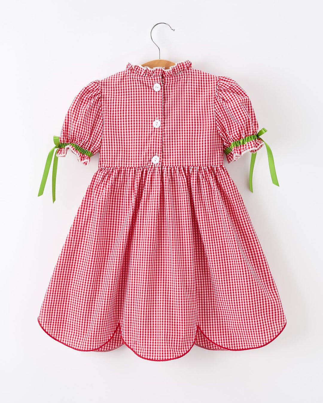 Red checkered dress with green trim on a white background