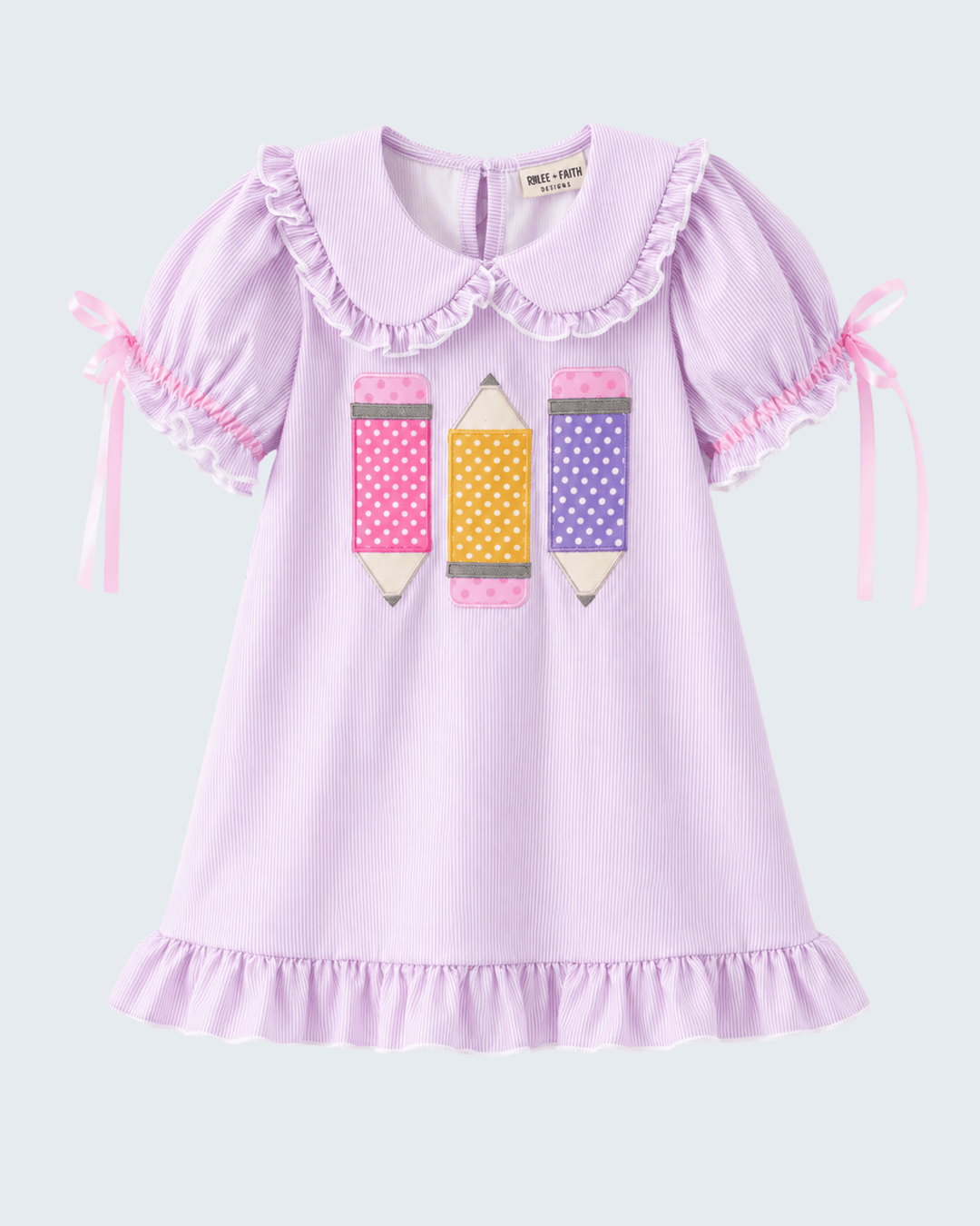 Purple back to school dress with pencil appliques.