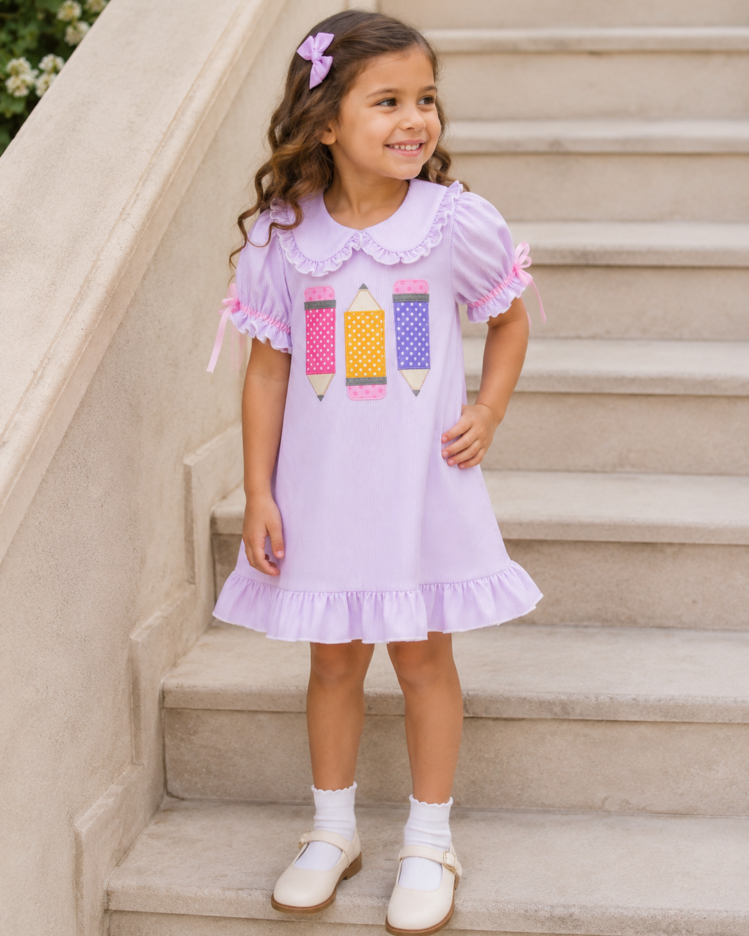 Young girl on stairs in purple back to school dress