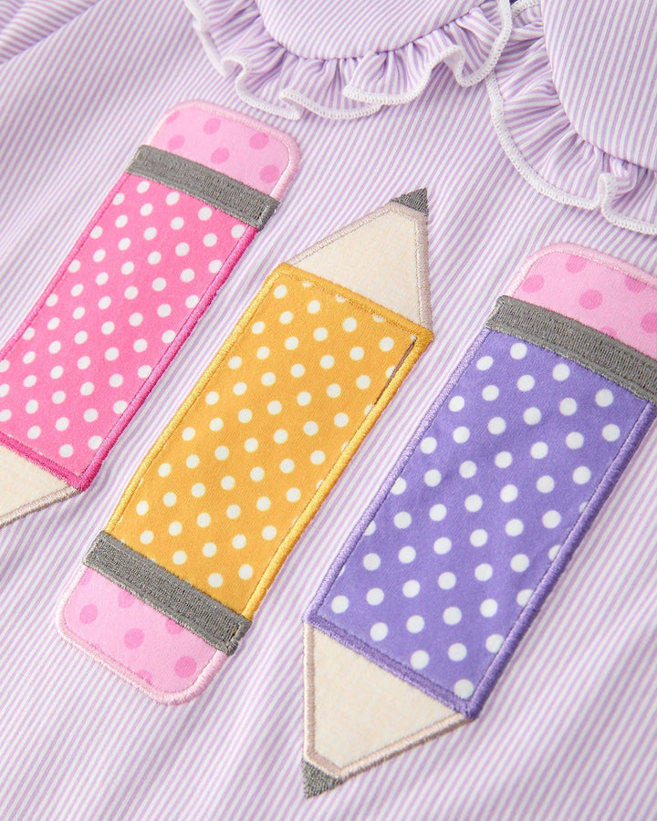 Three fabric pencil-shaped bookmarks with polka dot patterns on a striped background