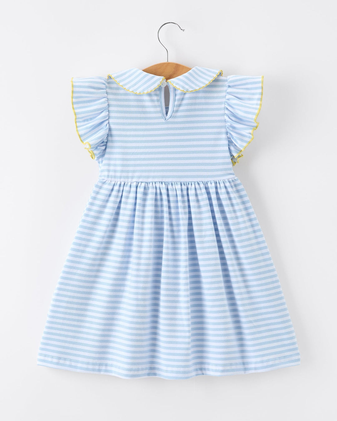 Light blue striped dress with yellow trim on a hanger against a white background