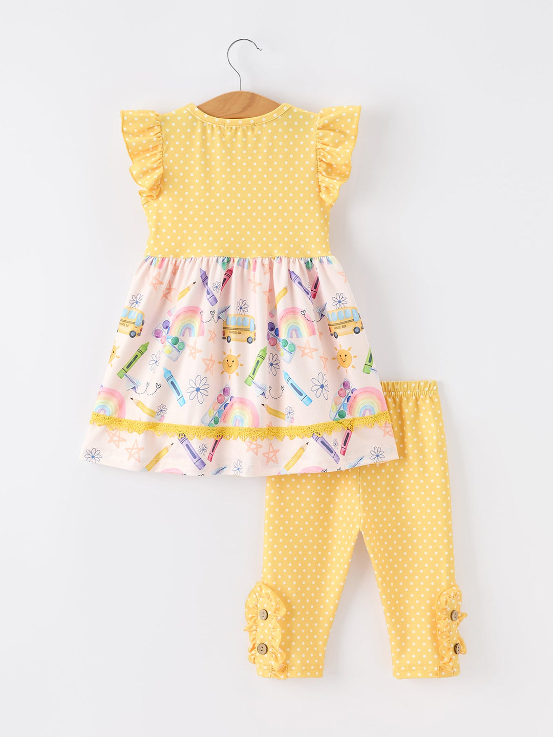 Yellow dress with colorful crayon pattern and matching leggings on a white background