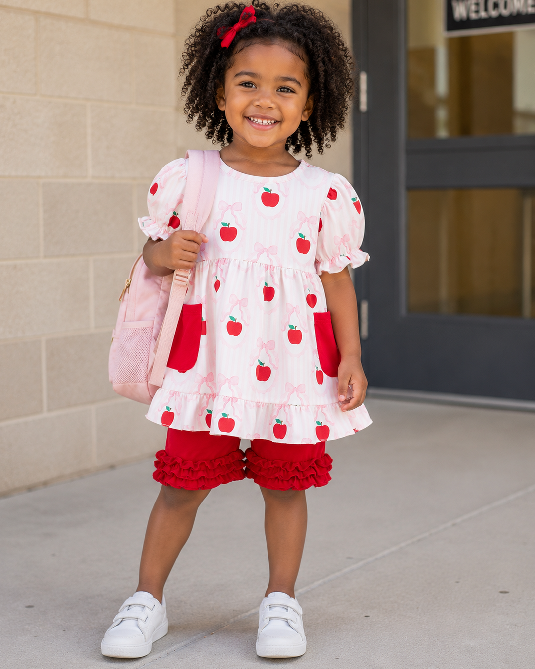 Girl standing outside wearing Back To School Ruffle Shorts Set