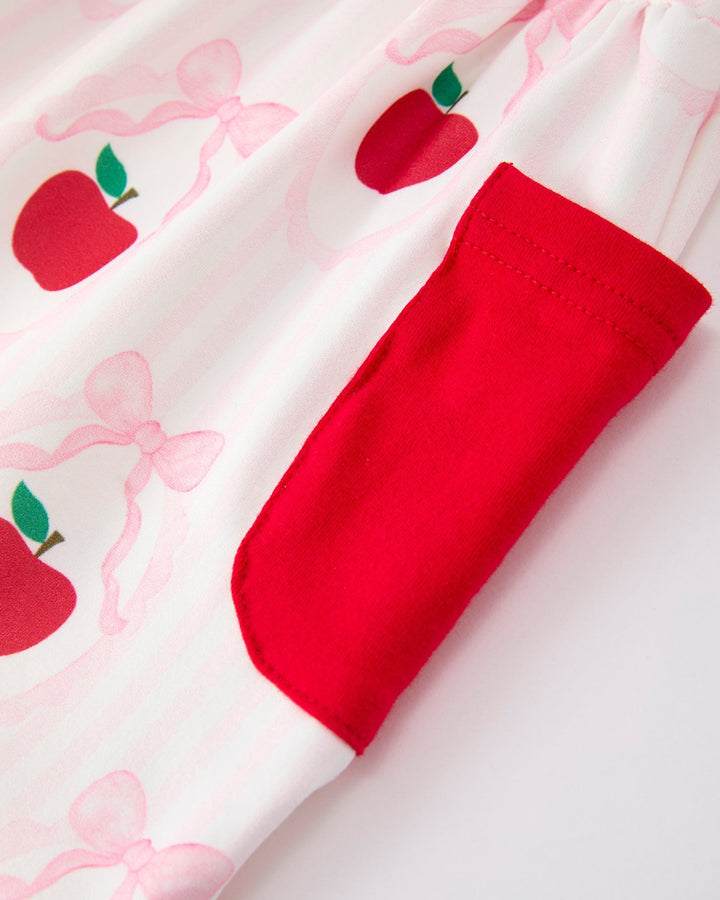 Red pocket on a white background with a pattern of red apples and pink bows.