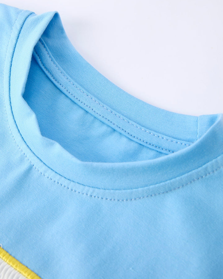 Close-up of a blue garment with a white background