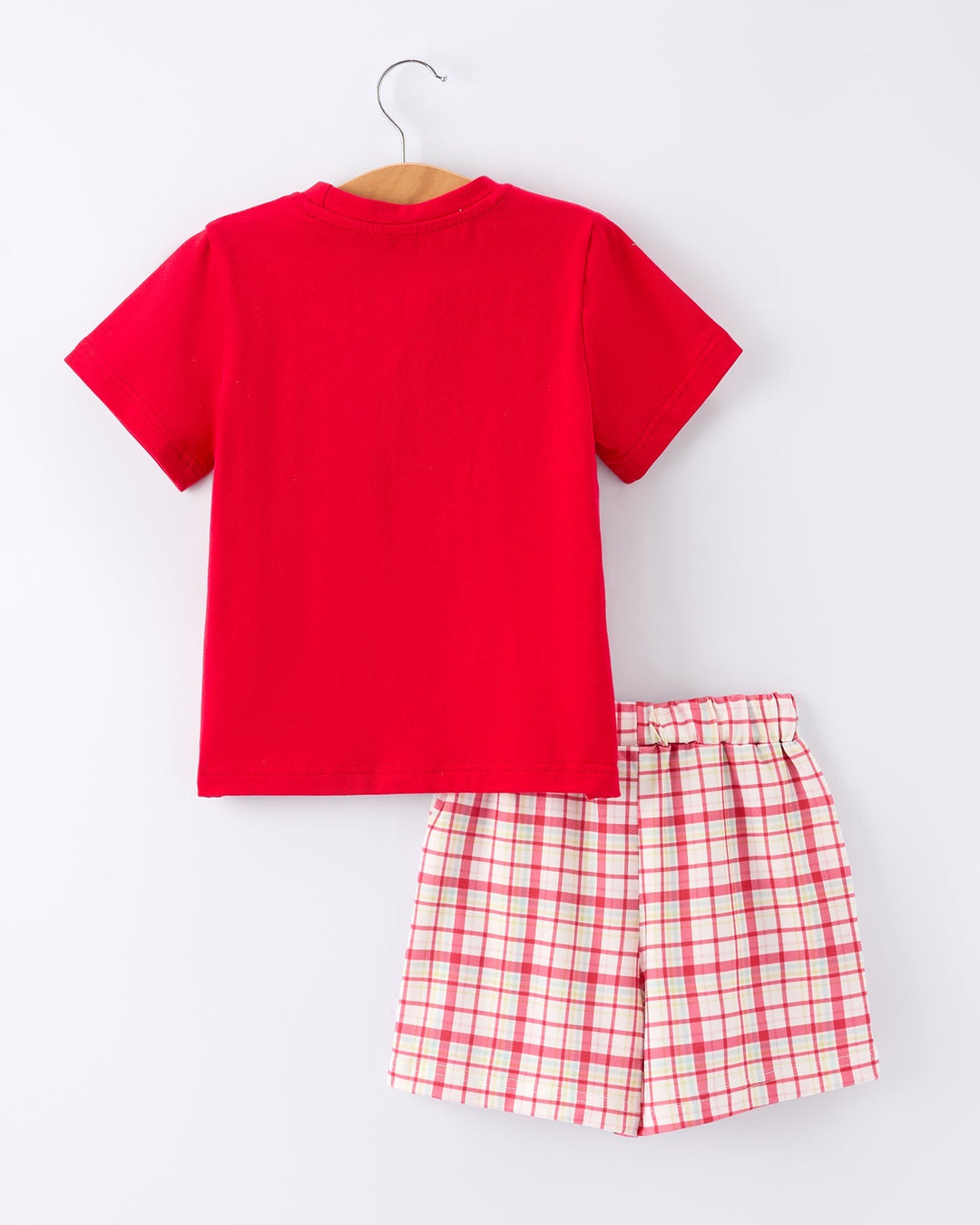 Red t-shirt and checkered shorts set on a white background