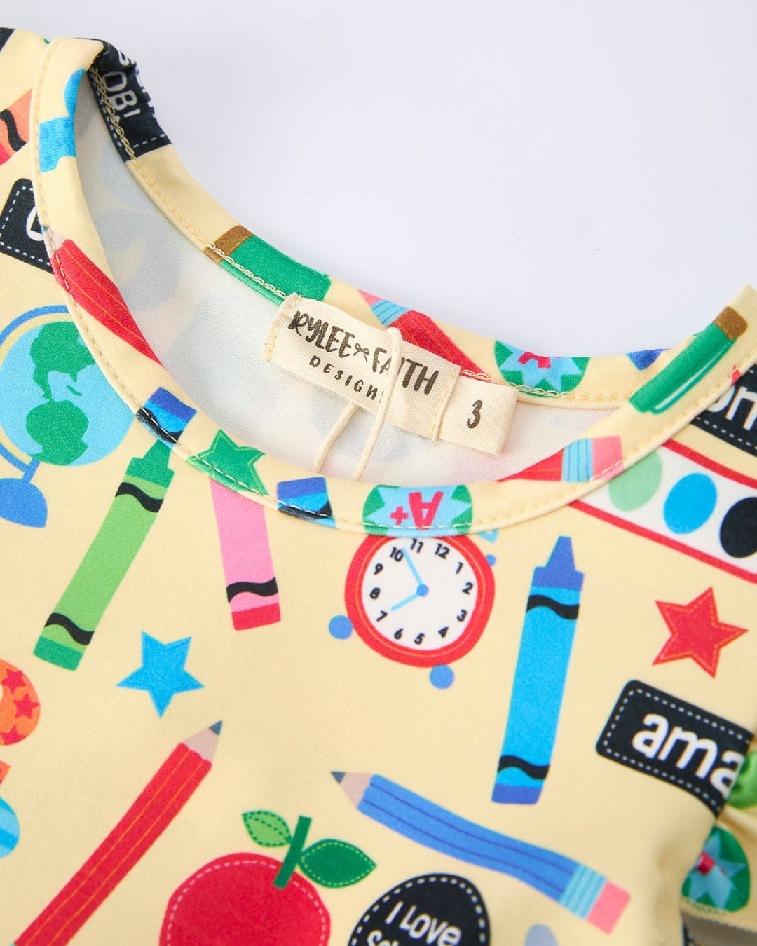 Dress with colorful educational design and brand labels.