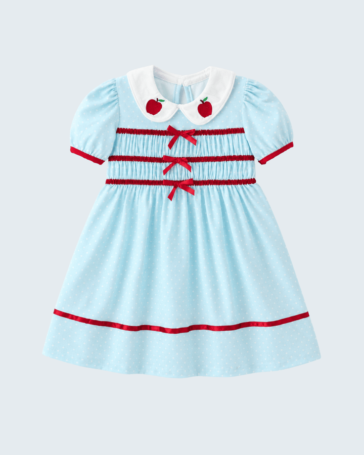 Light blue dress with red accents and cherry details on a light gray background